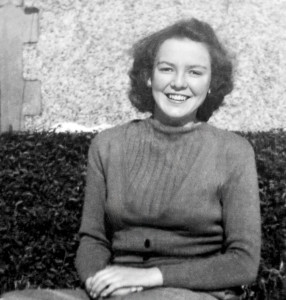 Emmie. Sitting in the back yard in Ireland, experiencing her first snow. She was in Standard 7 at the time. Emmie