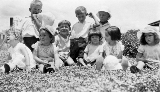 Emmie (third from the left) and Trevor with an assortment of unknown children Emmie and Trevor