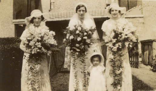 Granny Jones (left) at a wedding, young Emmy front Nan and Emmie